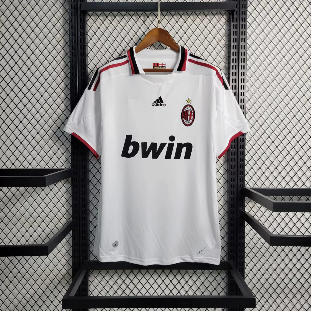 https://cdn.shopify.com/s/files/1/0911/7686/1985/files/ACMILAN2009_10AWAYSHIRT1.webp?v=1731947162